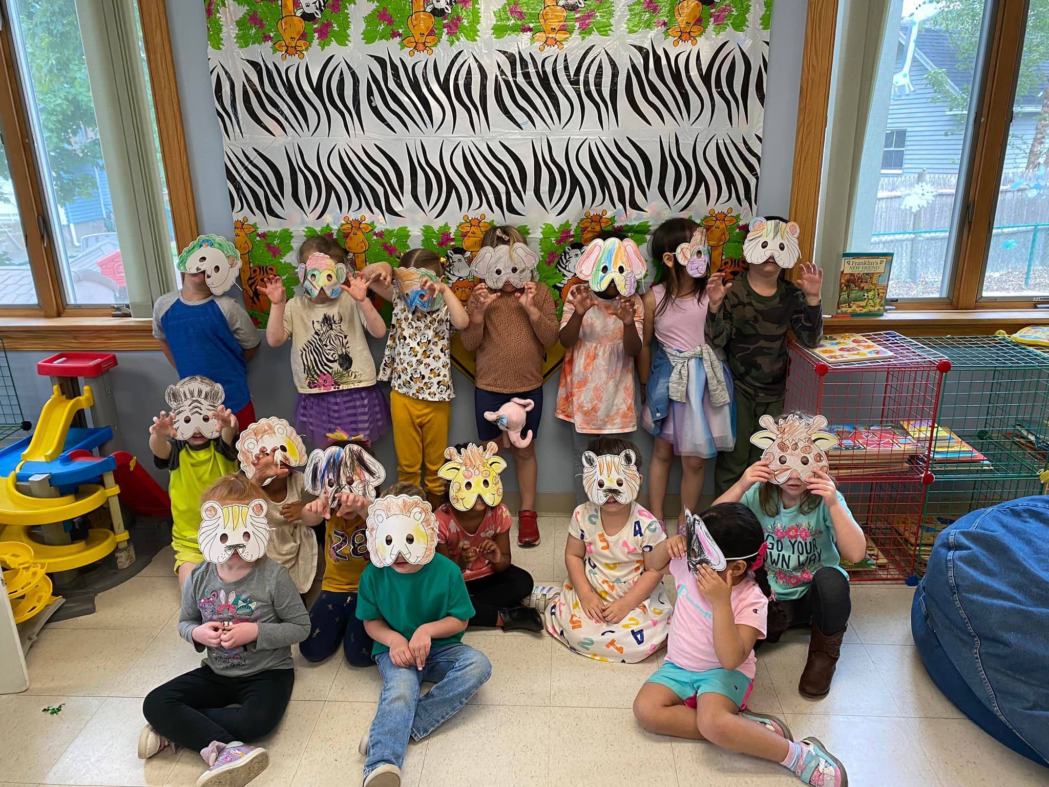 Children showing their lion masks which they colored.